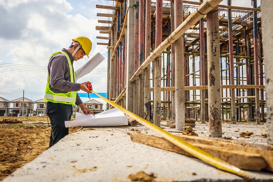 Asian business man construction engineer worker at house building site